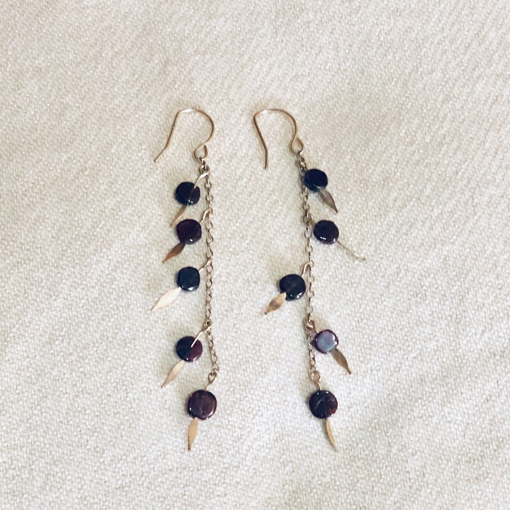 Gold filled dangling earrings with garnet beads.